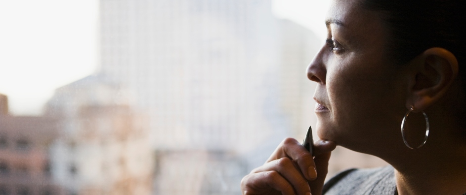 Woman looking out window