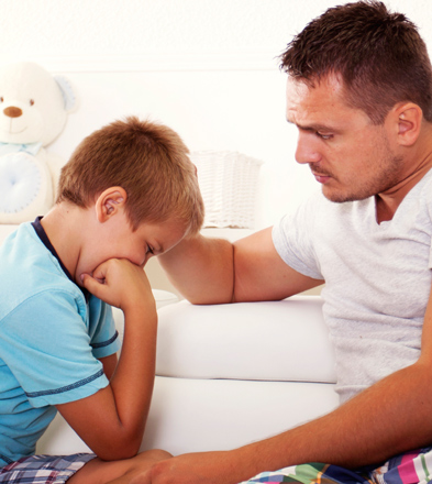 Boy-crying-with-father