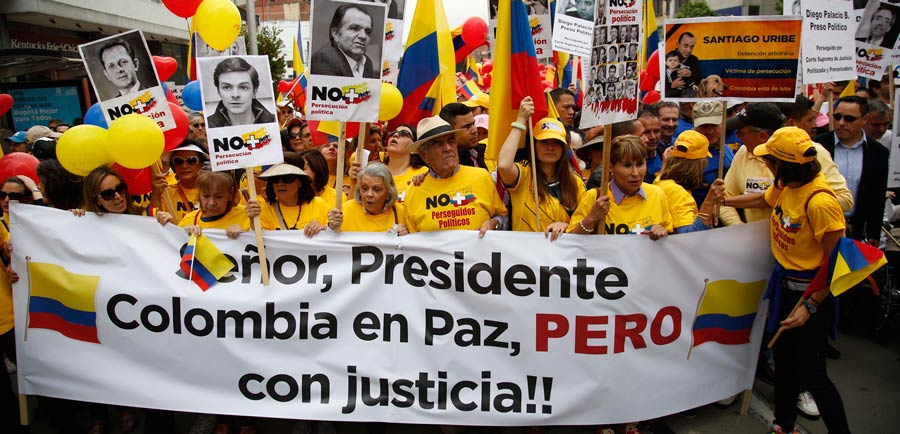 Colombian opposition led by former President Alvaro Uribe march to protest against President Juan Manuel Santos