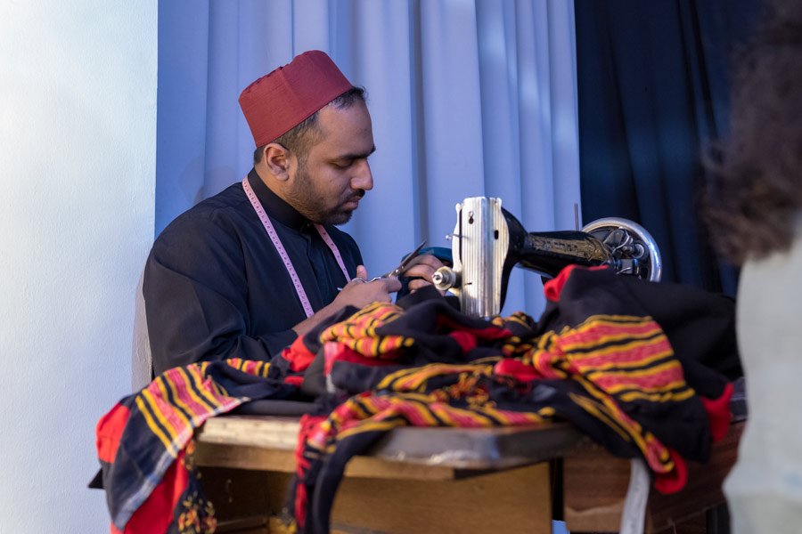 The exhibition contained historical accounts from the time of Baha’u’llah. Here, a young man playing the part of a tailor from 19th century Persia describes the types of garments that Baha’u’llah wore.