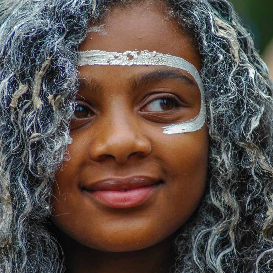 SYDNEY, NSW, AUSTRALIA - JANUARY 26, 2009: A member of Koomurri Aboriginal Dance Troupe taking part in a traditional Australian Aboriginal smoking ceremony on the sacred land of the Gadigal People.