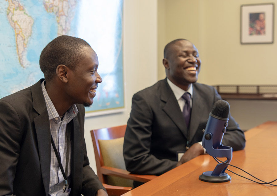 Charles Oloro (left) and Michael Okiria from Uganda speak about how growing numbers of people are attending regular gatherings for collective worship.