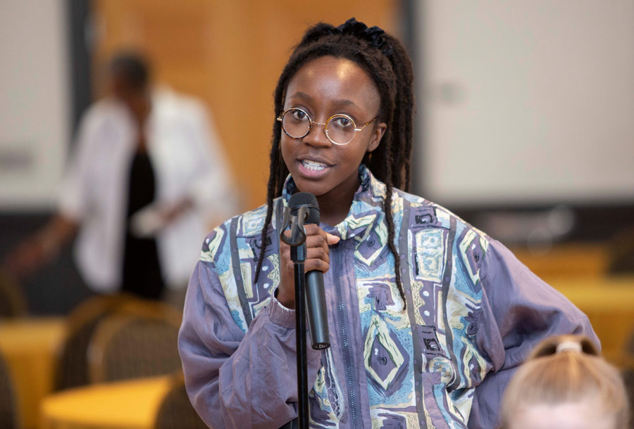 A student asks a question during the recent Baha’i Chair conference that focused on the equality of women and men.