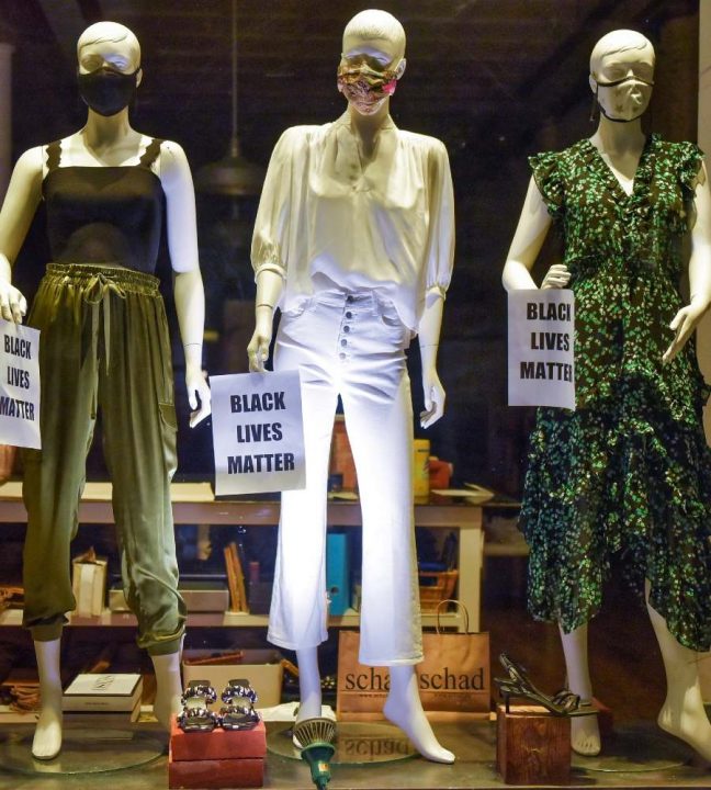 Mannequin display in the window of a women’s clothing boutique in Canada. 